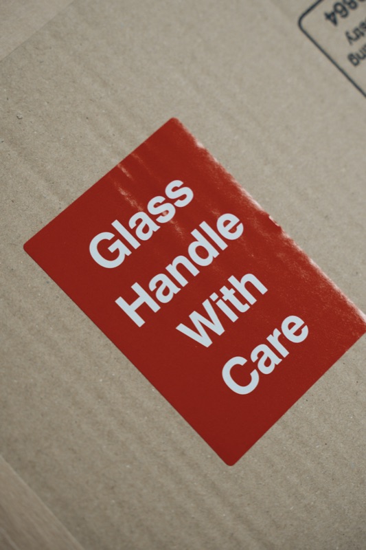 Art print packaging marked handle with care for shipping